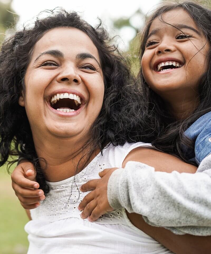 Mother and daughter laughing