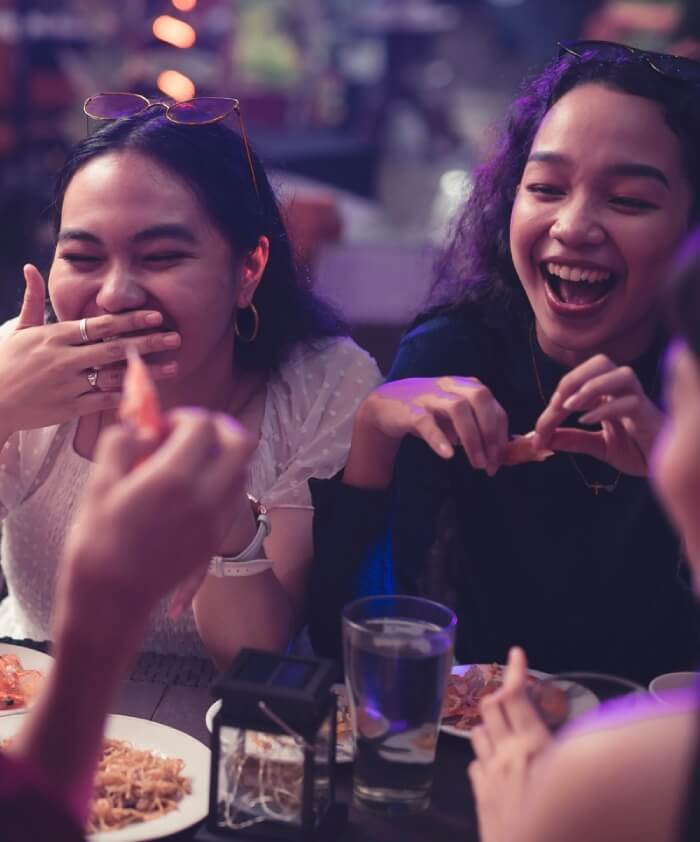 Teens out having fun at restaurant